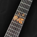 Guitare électrique flying V en bois vert et incrustations personnalisées